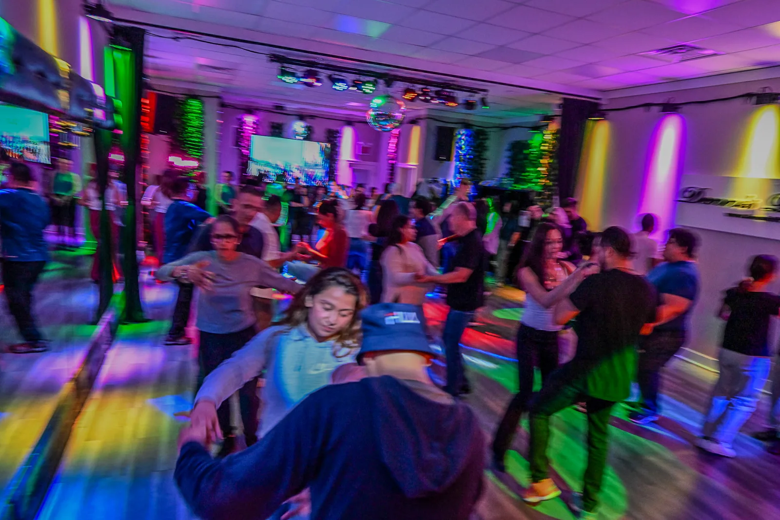 Students dancing salsa during a group class at Dennis PaSamba Dance Company in Chicago